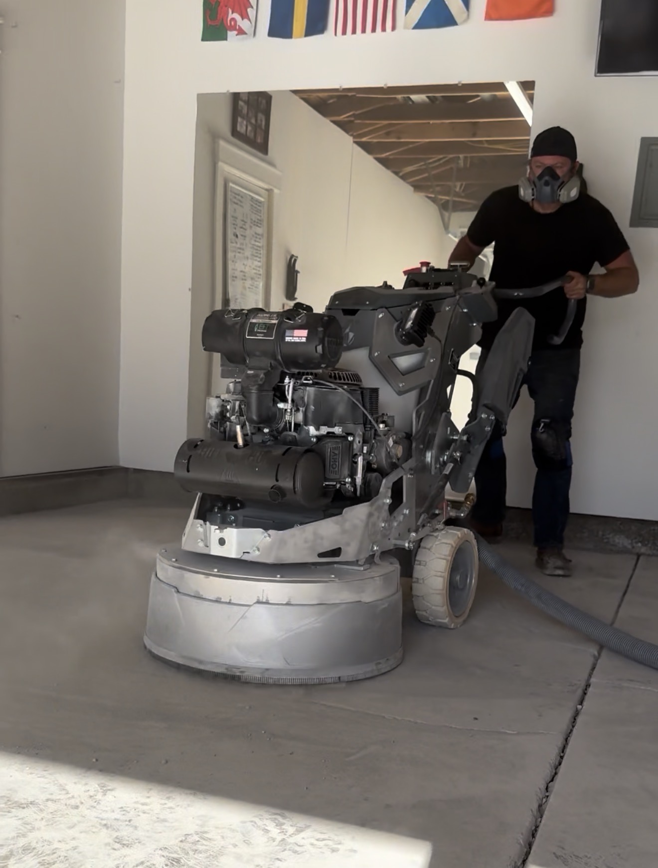 Buffalo Floor Coatings crew grinding concrete floor