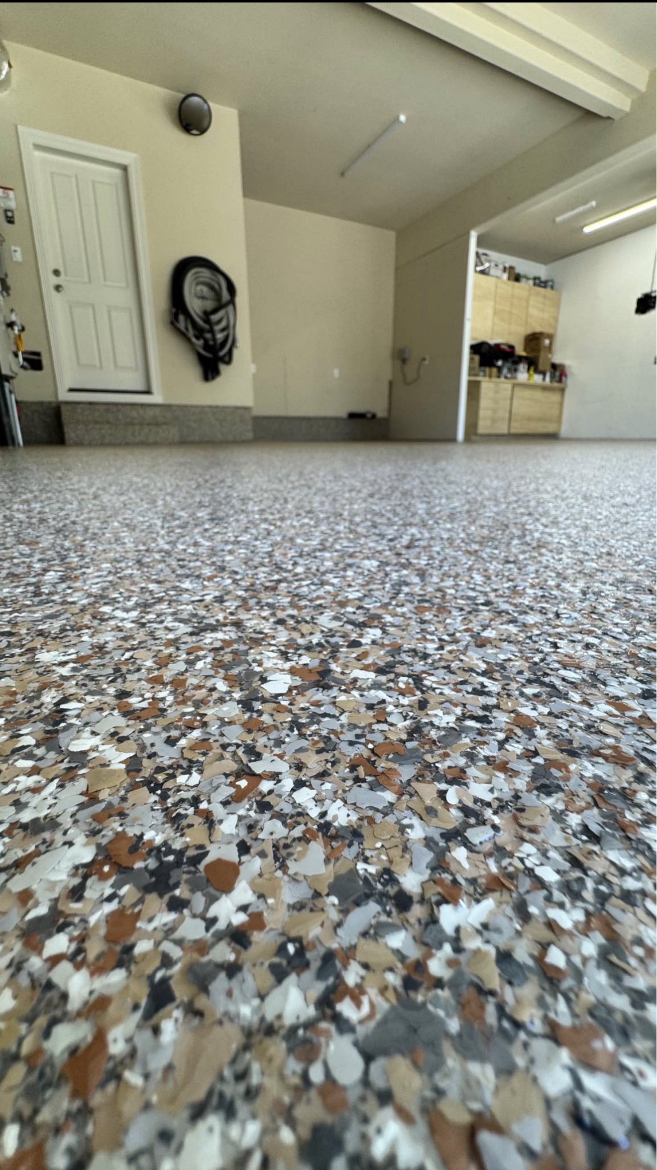 Close-up of decorative flake broadcast on garage floor
