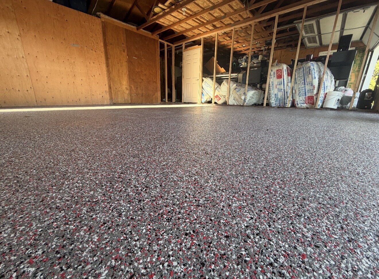 Finished flake polyaspartic floor in newly built garage